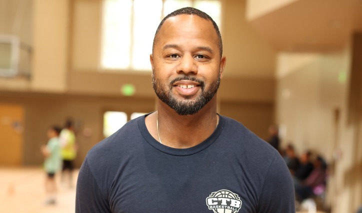 A headshot of Russell