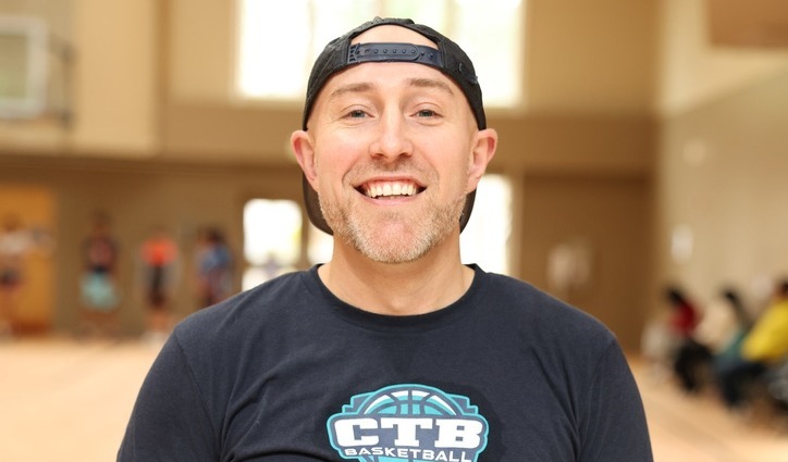 A Headshot of Travis