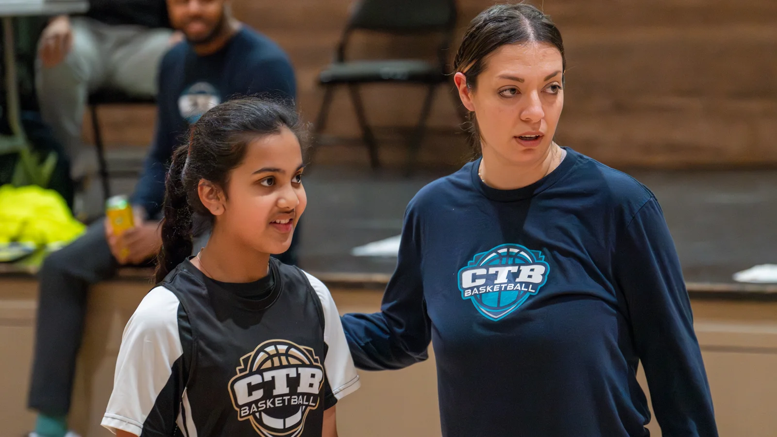 A basketball coach directing her player