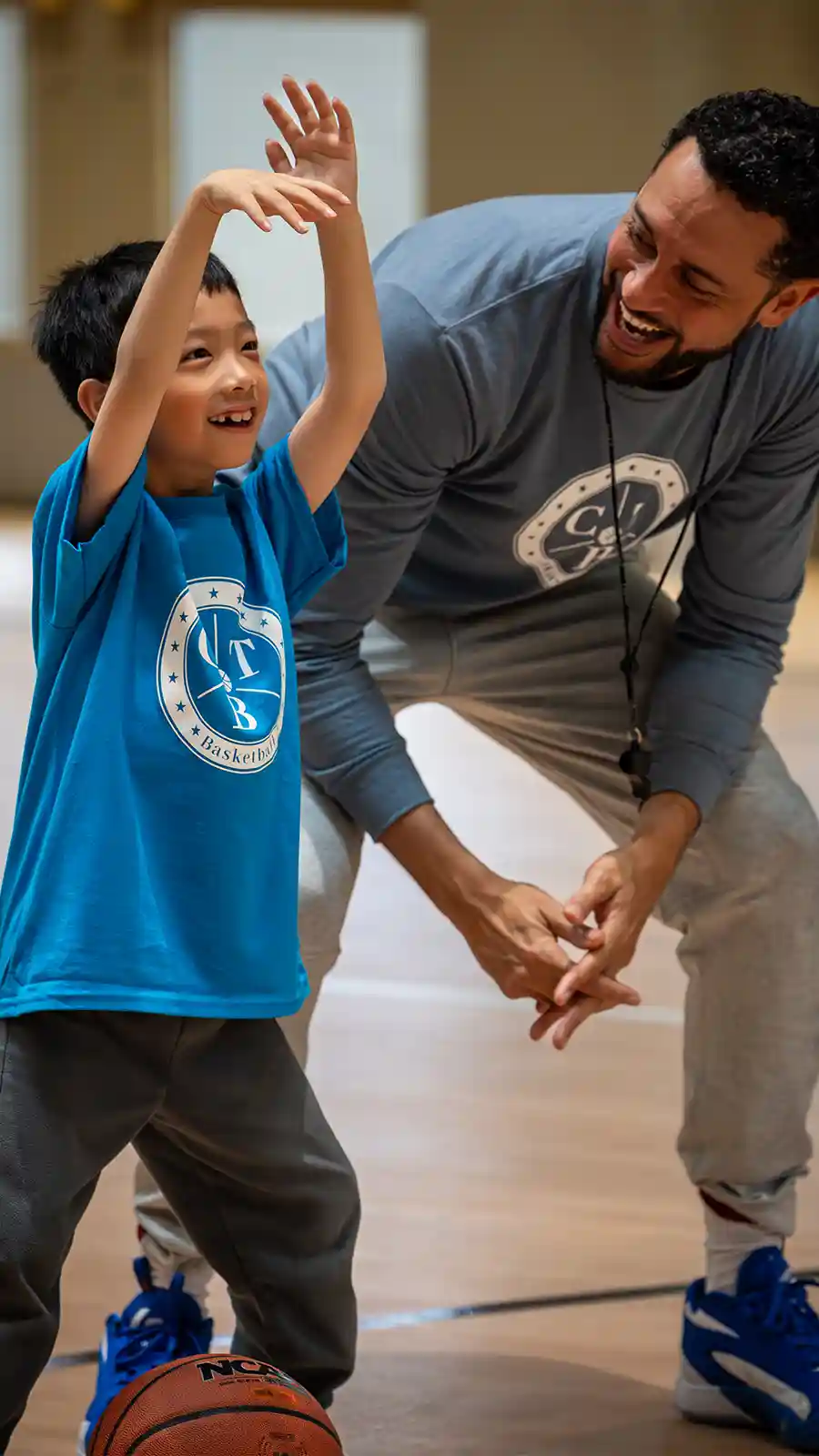 A young basketball player working on their shooting form